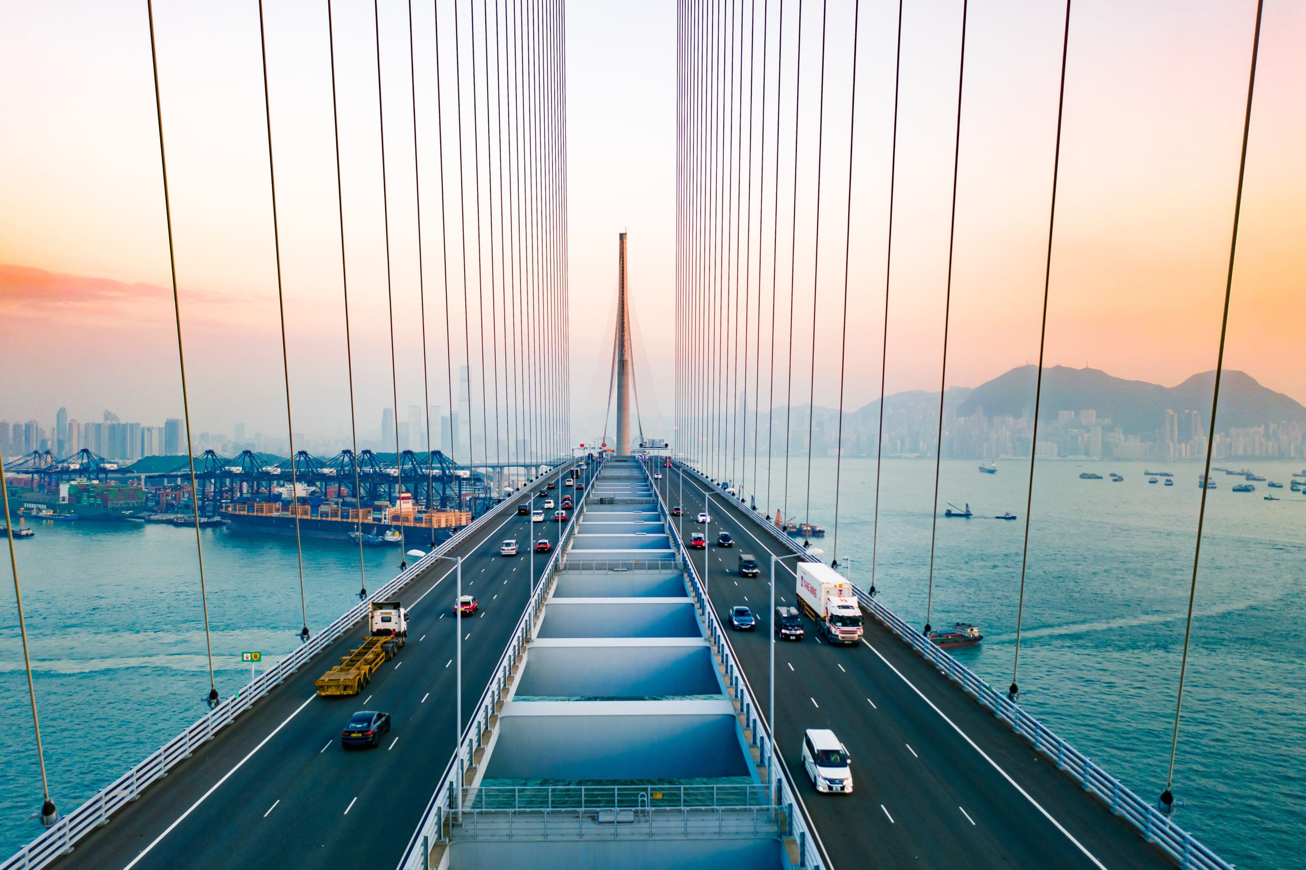 Drone view of Stonecutters Bridge and the Tsing sha highway at sunset Singapore